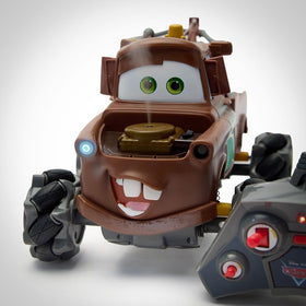 Disney Store Tow Mater RC car wheels race-ready on rugged terrain.