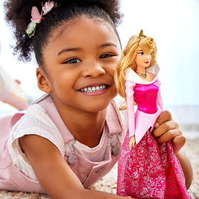 Disney Store Aurora doll with golden tiara for royal pretend moments.