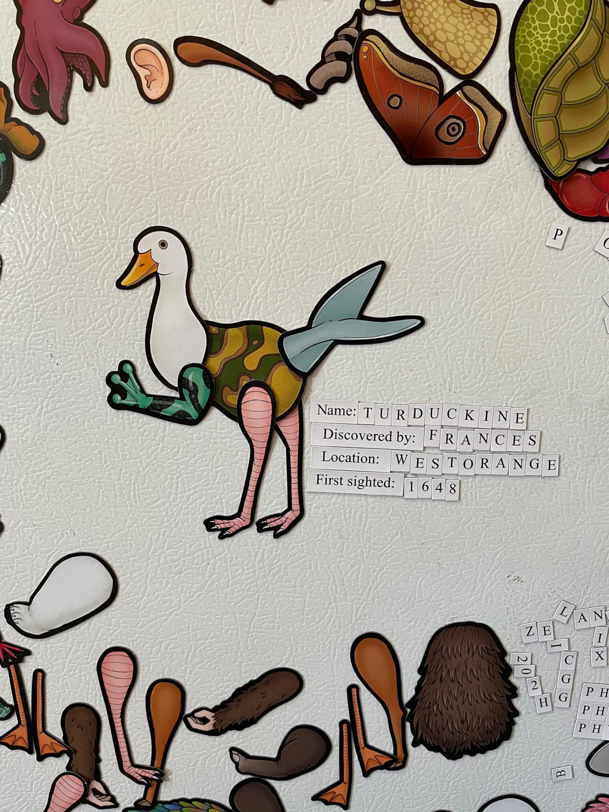 Dissent Pins Cryptid Kit on a fridge shows quick, creative play sessions