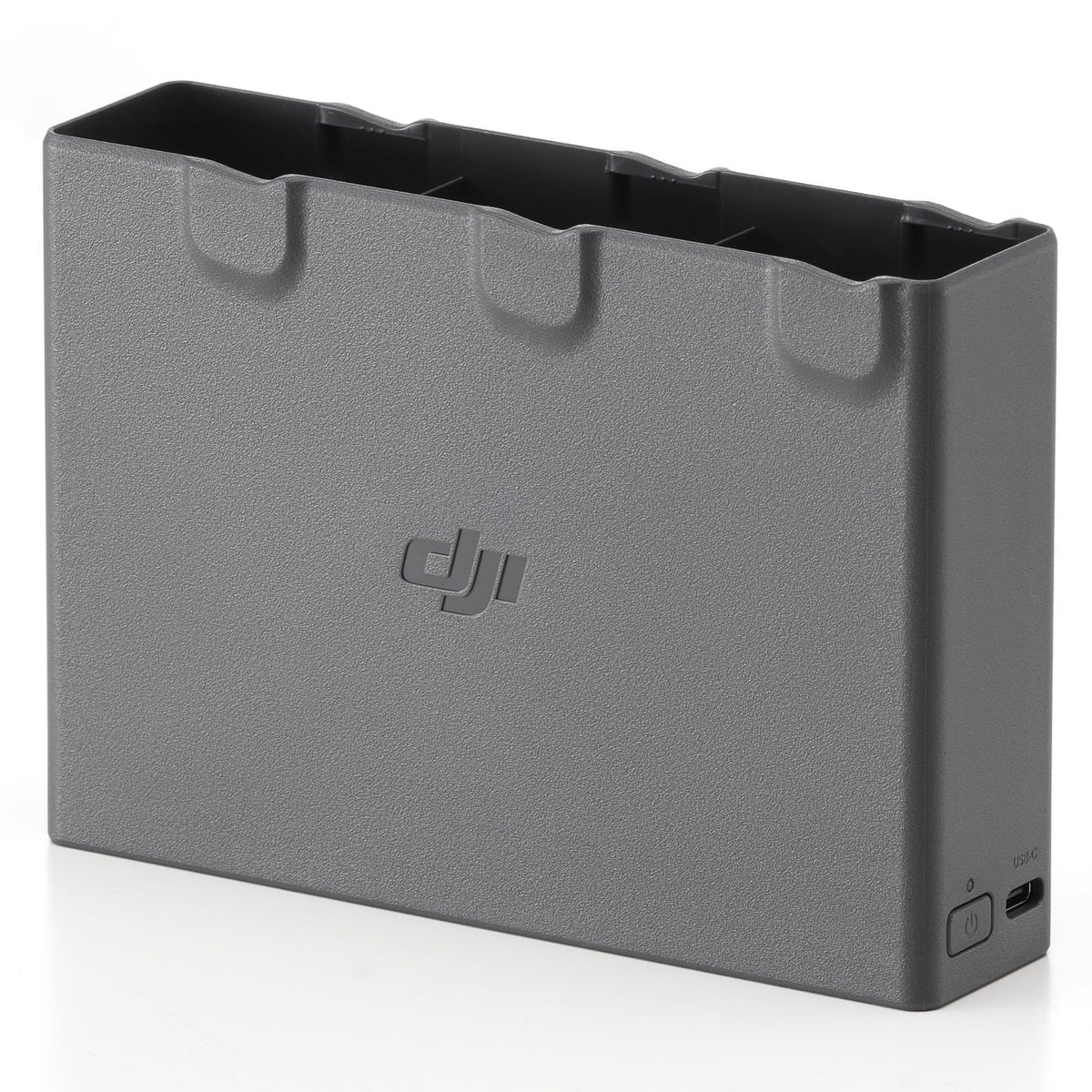 DJI Avata 2 Two-Way Charging Hub on desk powering three batteries
