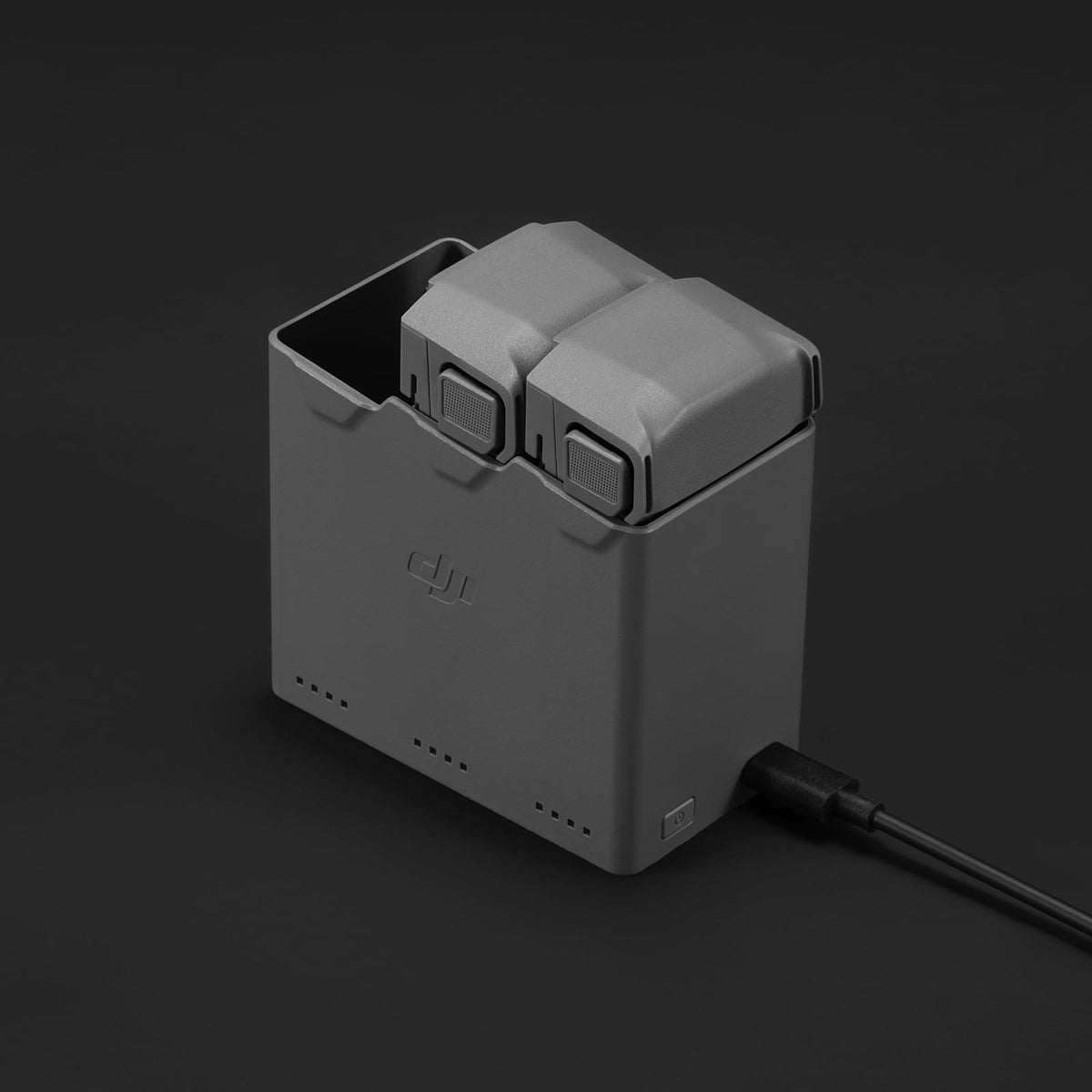 DJI Mini 5 Pro charging hub powers a controller and phone on the go