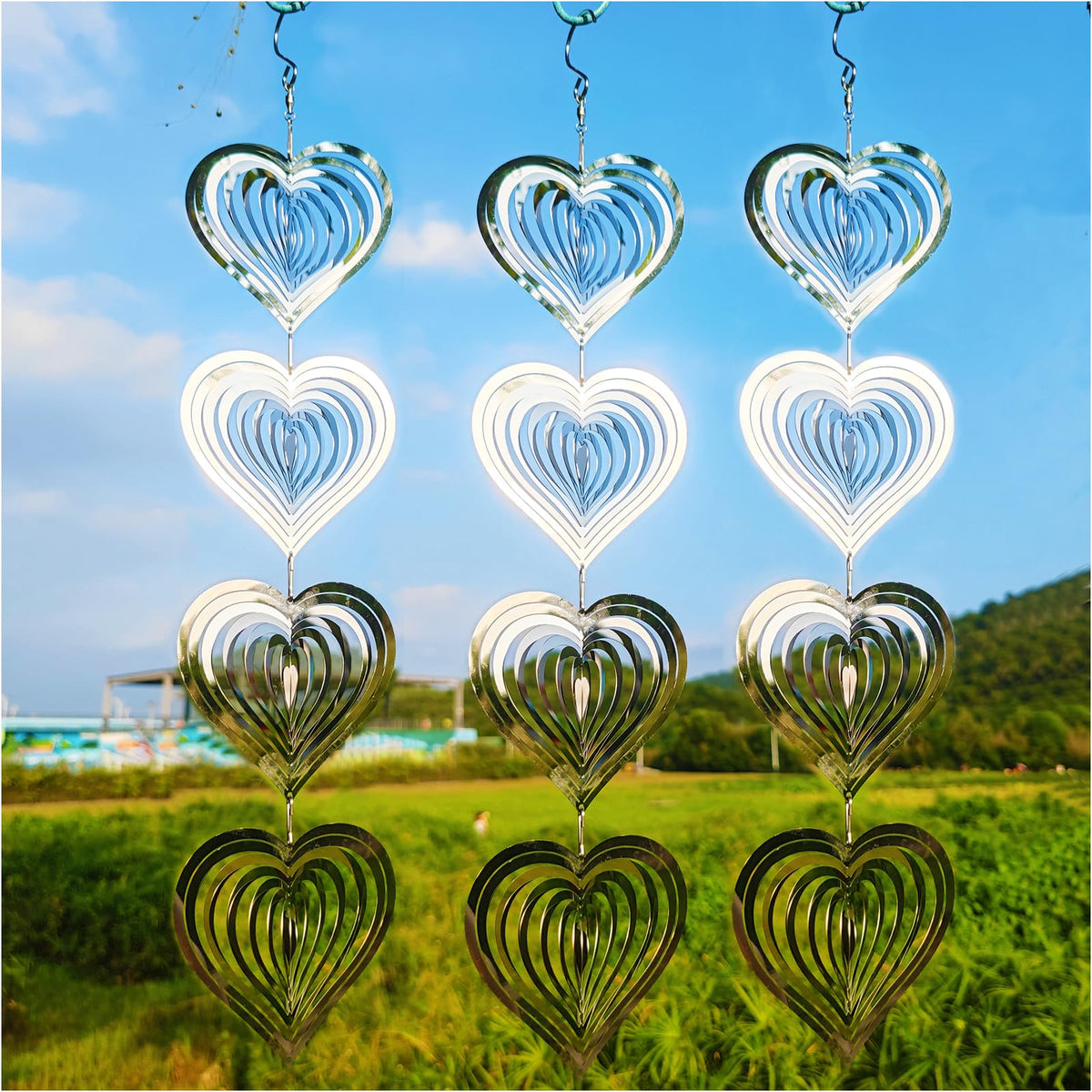 DJUAN Heart Wind Spinner Disc spins in sun to deter birds.