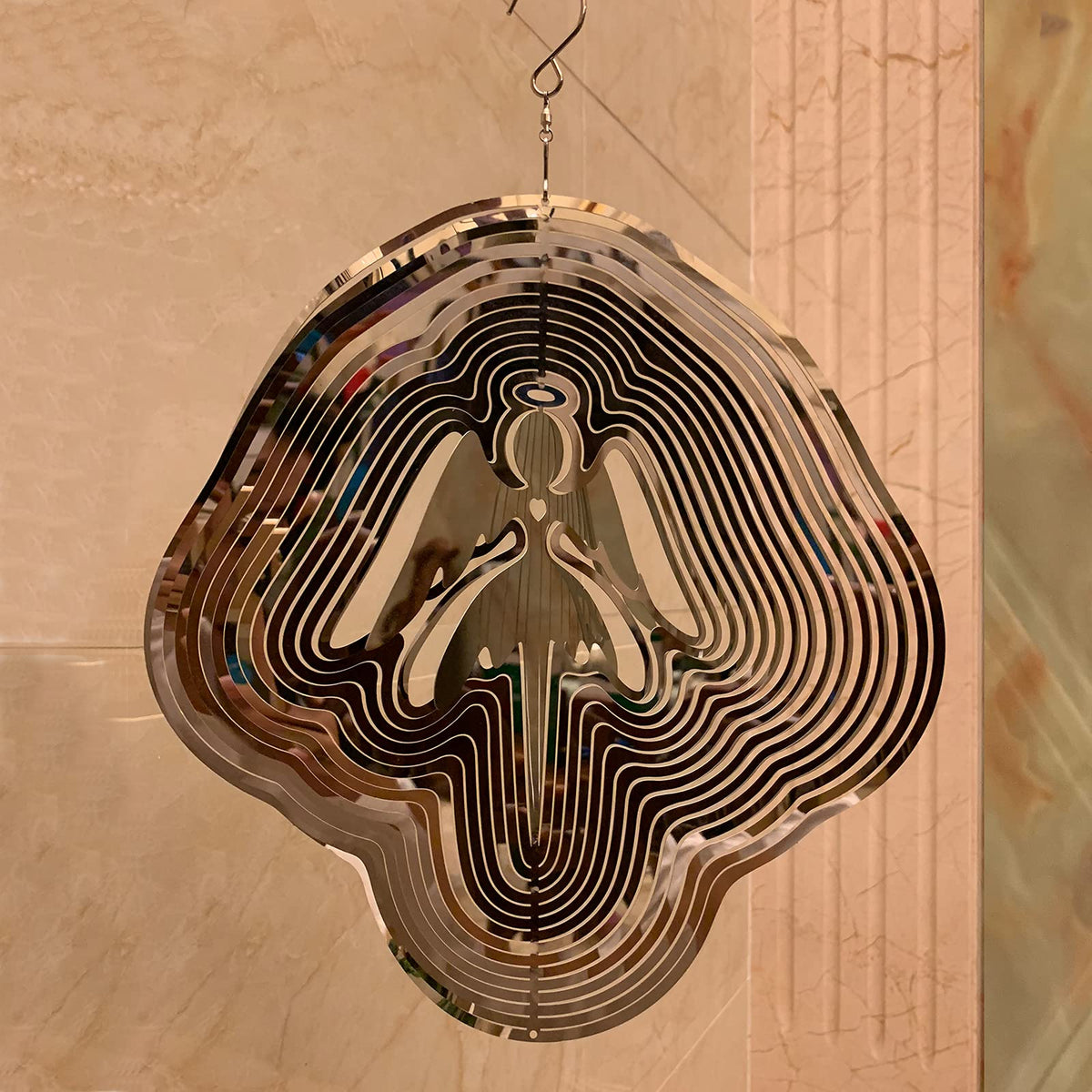 DJUAN mirror-reflection angel spinner catching sun colors