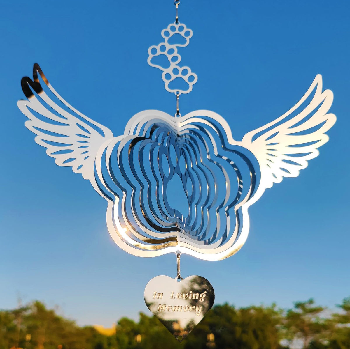 DJUAN sparkly wind spinner reflection—catches sunlight and brightens outdoor spaces.