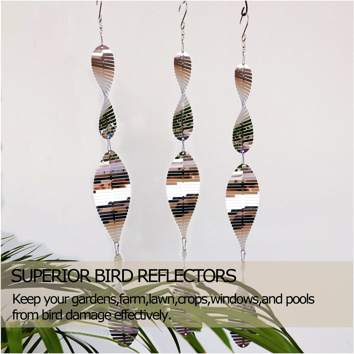 DJUAN sunlit garden display featuring shimmering bird discs for deterrence