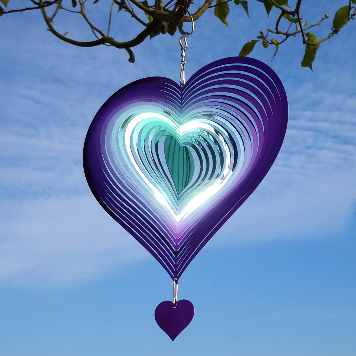 DJUAN wind spinner hung on lamp or tree, inviting gentle motion in light breezes.