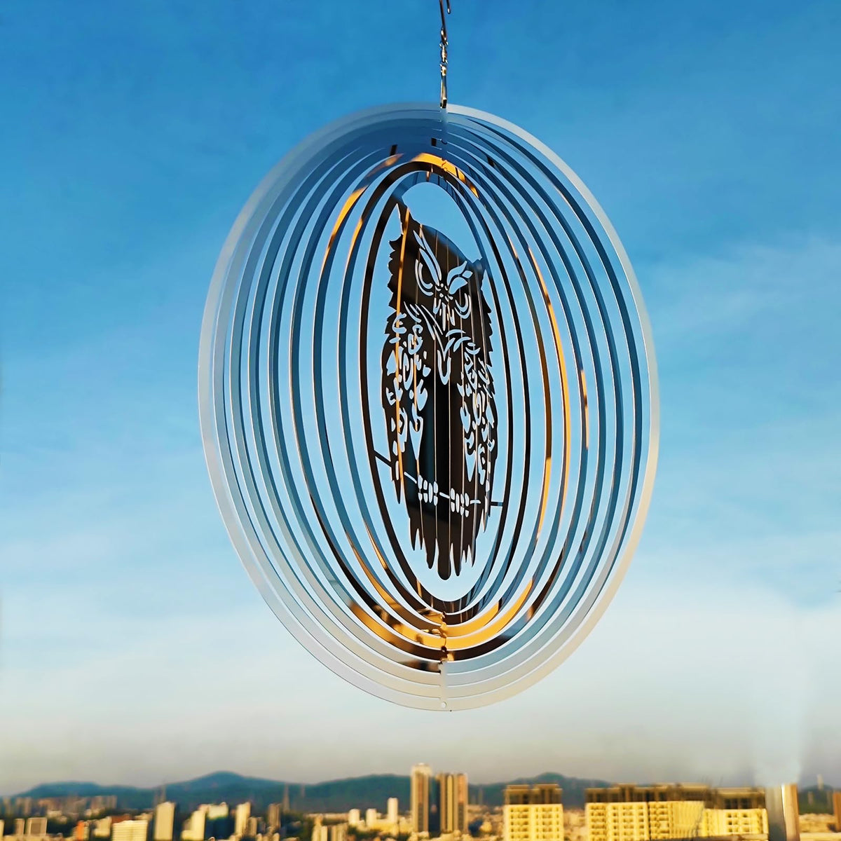 DJUAN wind spinner with mirror finish adds decorative motion while repelling birds.