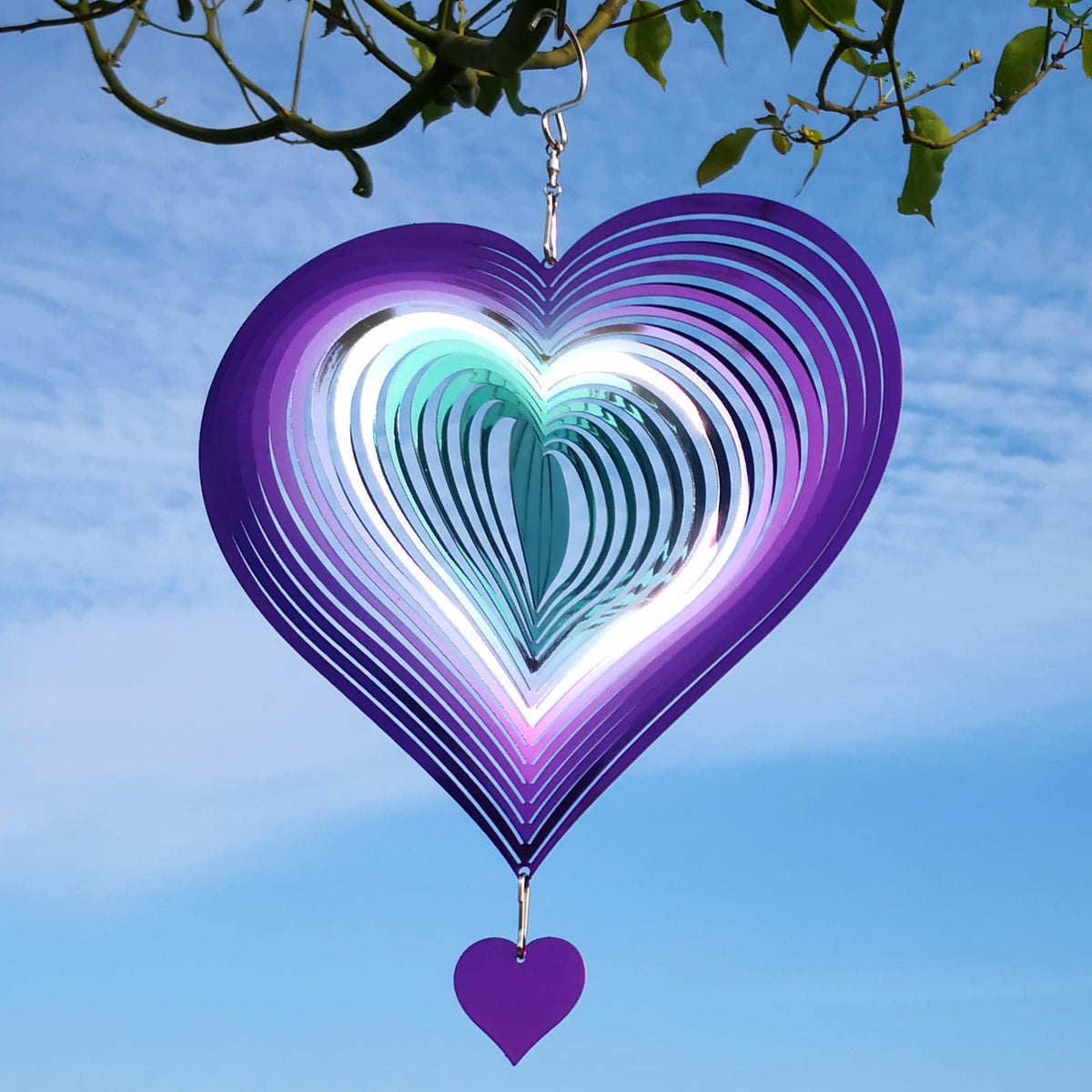 DJUAN wind spinner shows pulsing reflections at night, adding magical ambiance to outdoor spaces.