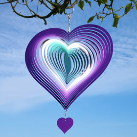 DJUAN wind spinner shows pulsing reflections at night, adding magical ambiance to outdoor spaces.