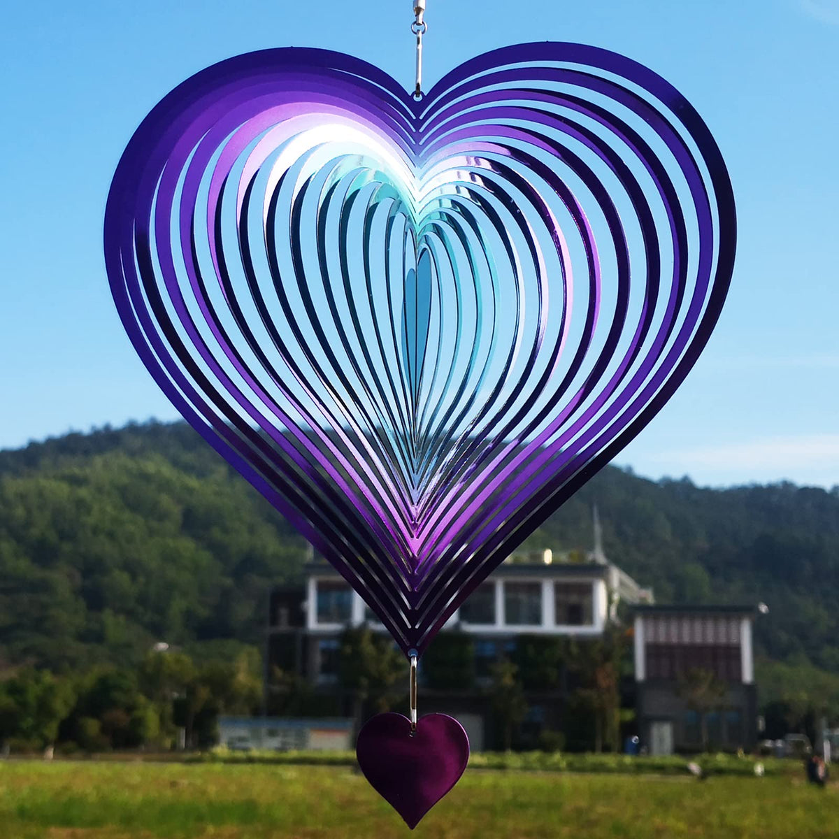 DJUAN wind spinner in purple-green gradient heart, a striking 3D metal hanging decor for yards.