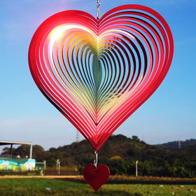 DJUAN wind spinner with red-yellow gradient heart delivers striking 3D reflections in outdoor spaces.