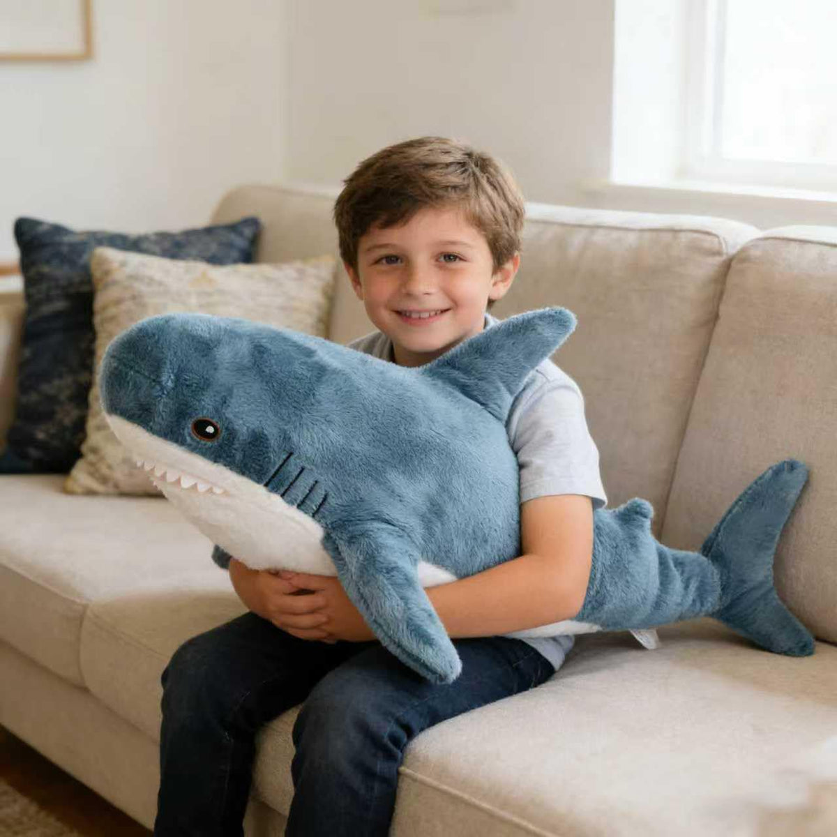 Djungelskog shark plush serves as a travel-friendly cuddle companion.