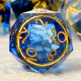 DNDND D4 die close-up showing inner gold ring in blue resin.