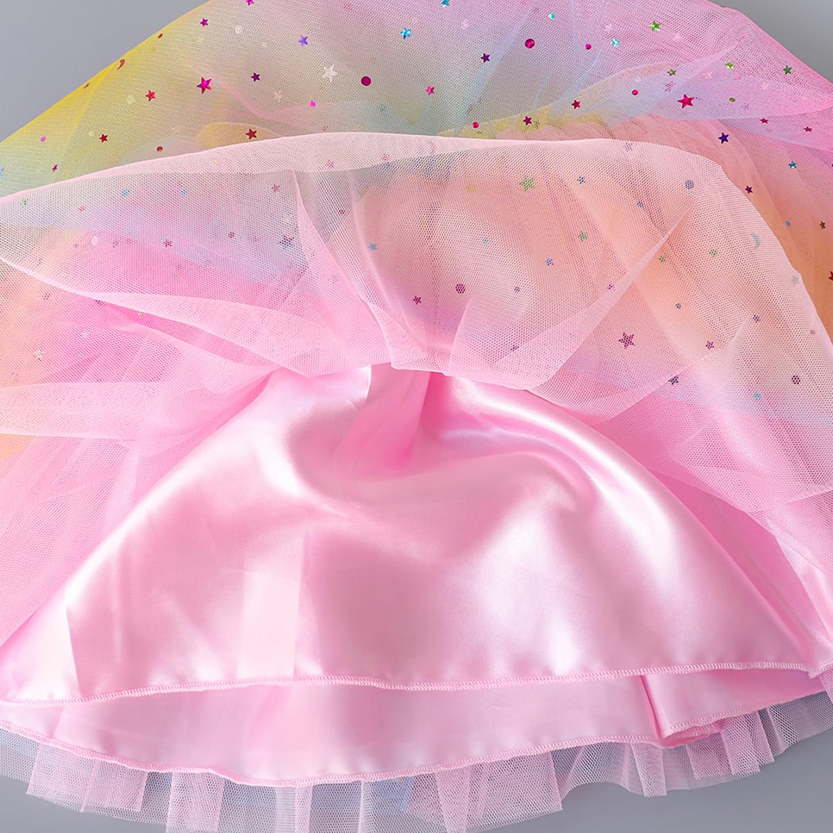 Doctor Unicorn hair bow in soft tones coordinates with tutu and shirt.