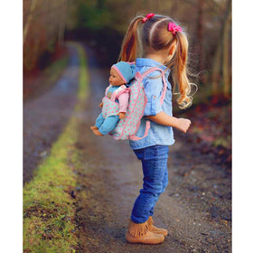 Dolls To Play pink backpack carrier take-along supports portable pretend play.