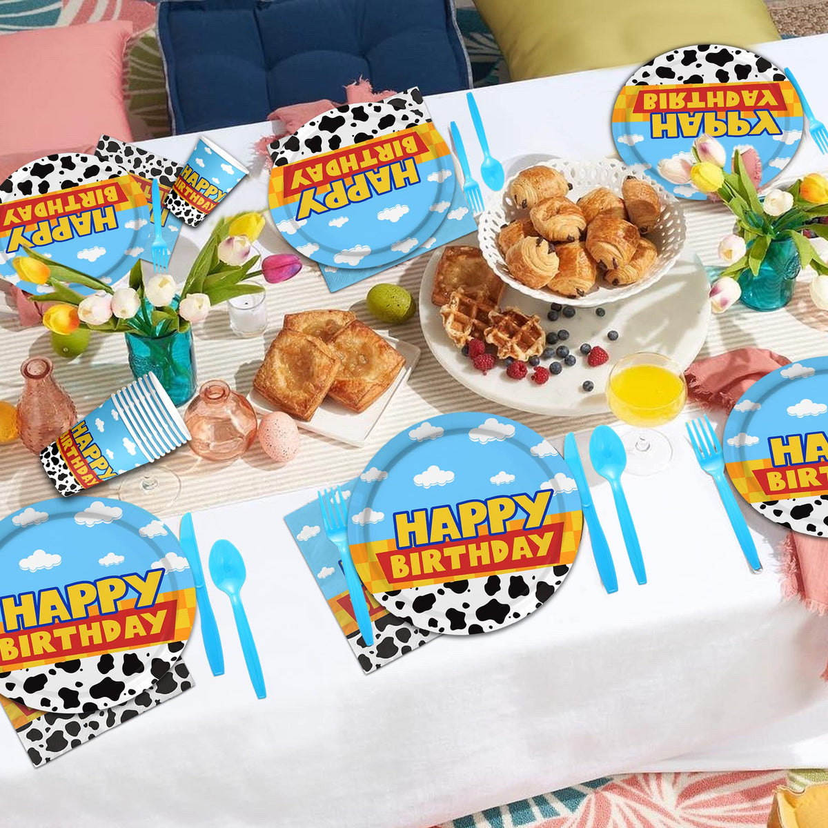 Domment cow-cloud tableware close-up: charming theme accents enhance party decor.