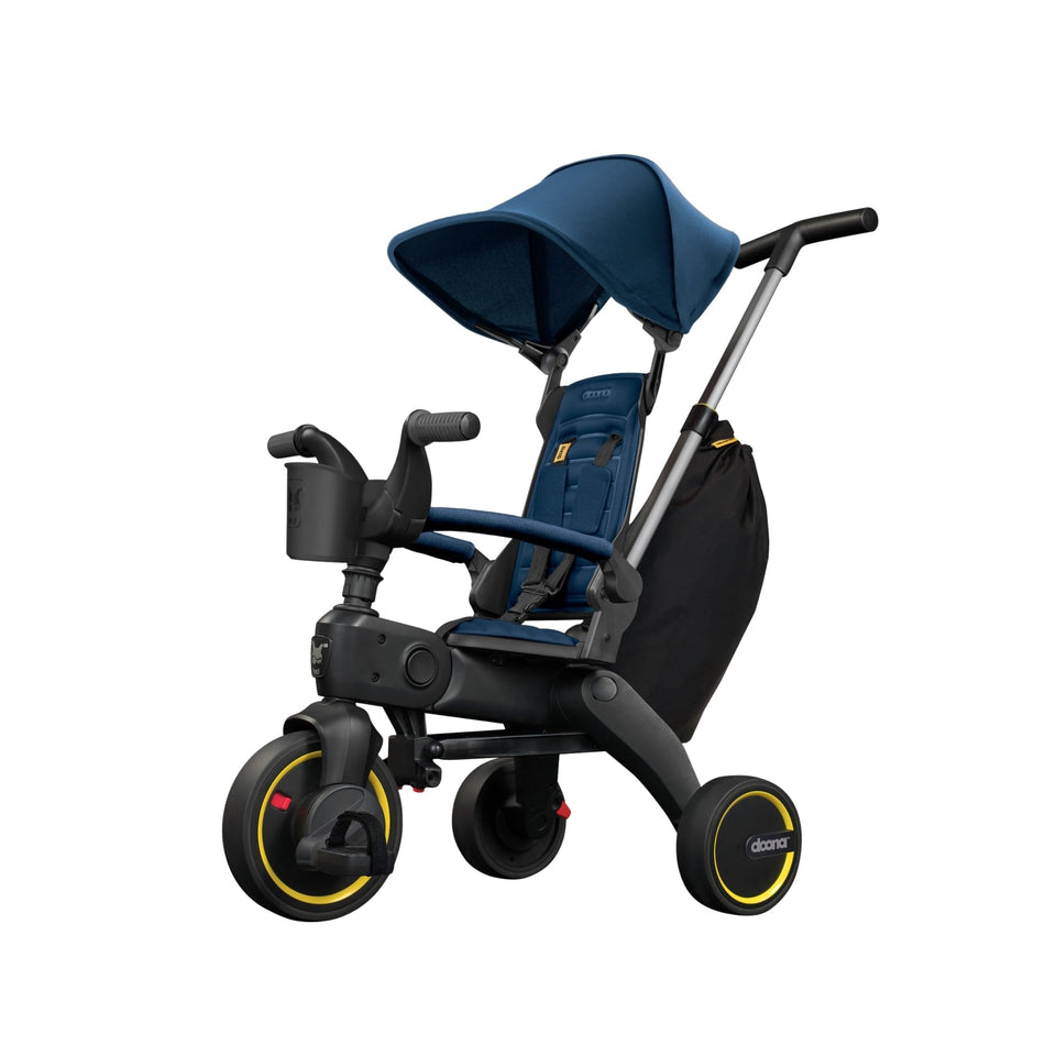 DOONA Liki Trike S3 royal blue folded for compact travel storage and quick setup