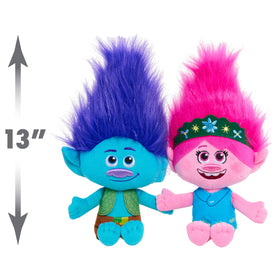 Poppy and Branch in movie-inspired outfits with sparkly accents for vibrant playtime.