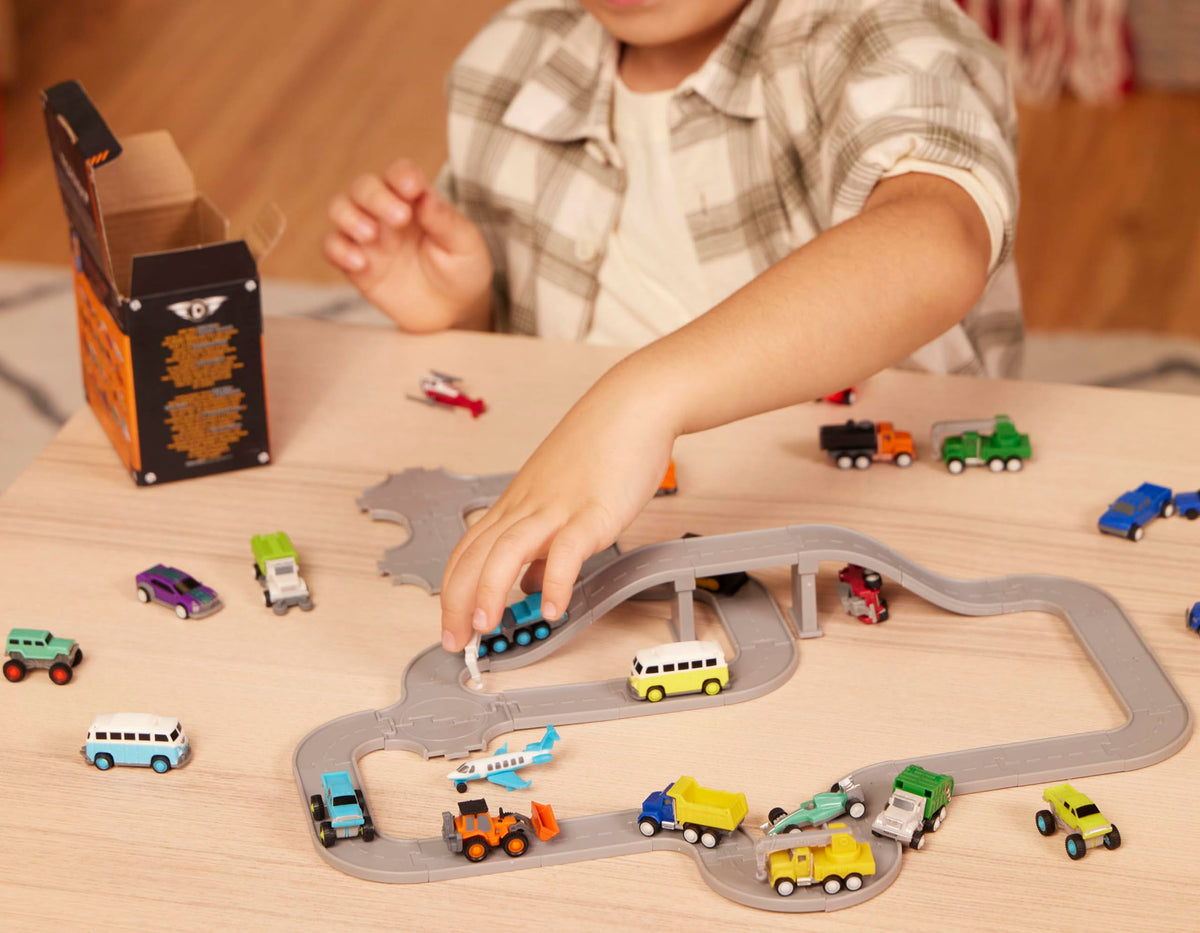 Driven by Battat Pocket Fleet cement mixer toy for construction play at home.
