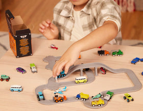 Driven by Battat Pocket Fleet cement mixer toy for construction play at home.