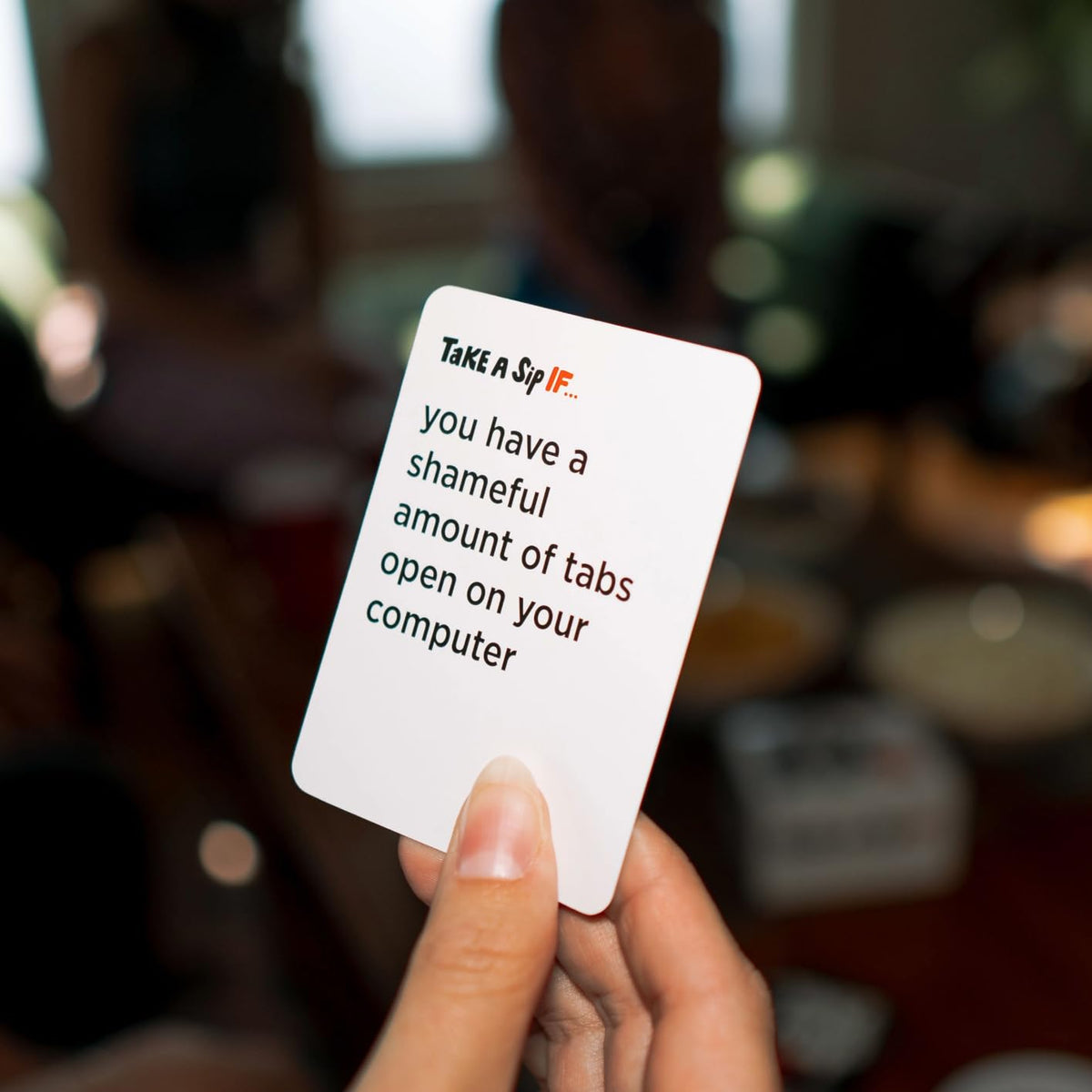DSS Games Take A Sip If… group of friends enjoying a lively game night