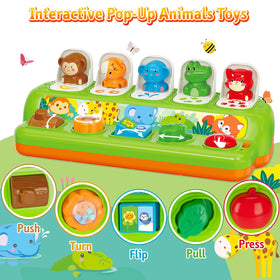 Baby grasps the Duchong Pop Up Toy for fine motor practice