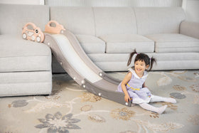 Duke Baby anti-skid pads keep the slide steady on a sofa.