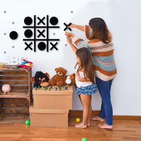 DUOLIYBC Magnetic Tic Tac Toe in a family room scene.
