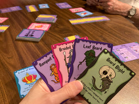 Spell cards and beard power themes on the table ready to play.
