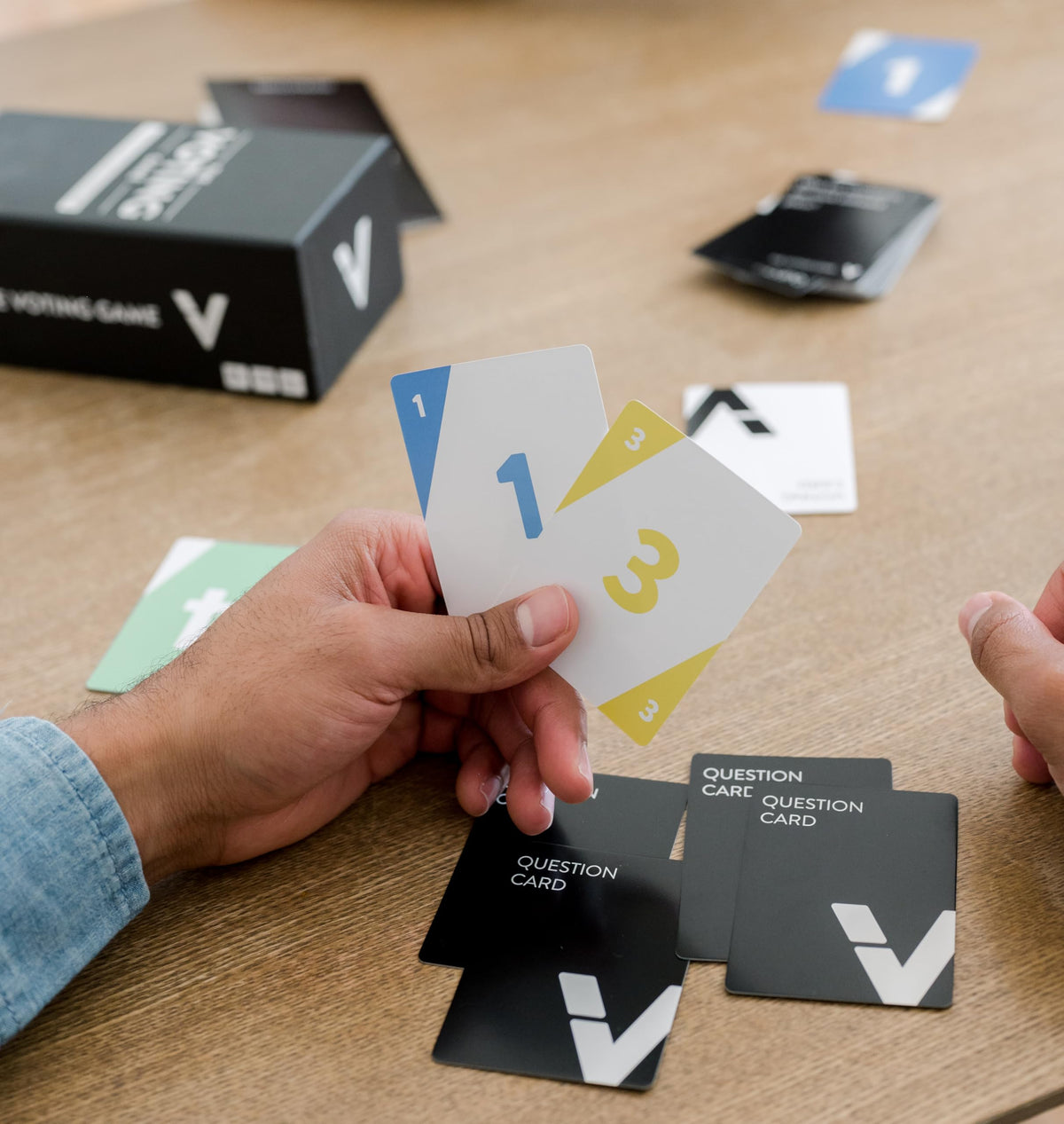 Compact card deck and playtime details of DYCE The Voting Game.