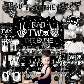 Dydamud Bad Two The Bone banner and tablecloth unify party styling.