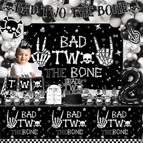 Dydamud Bad Two The Bone cake topper adds a themed dessert focal point.