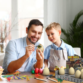 A child digs with EARTH'SCODE tools to unearth a dinosaur.