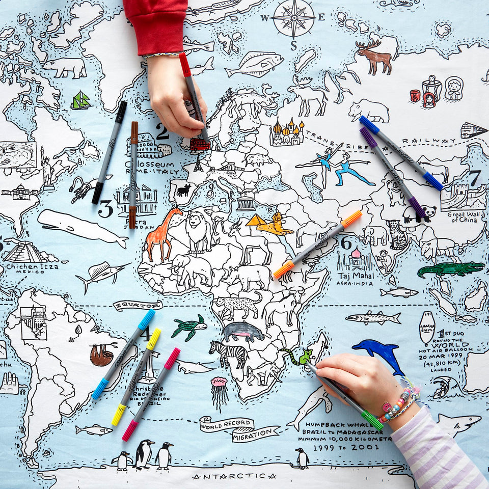 eatsleepdoodle world map tablecloth flatlay for kids' coloring fun and creative learning