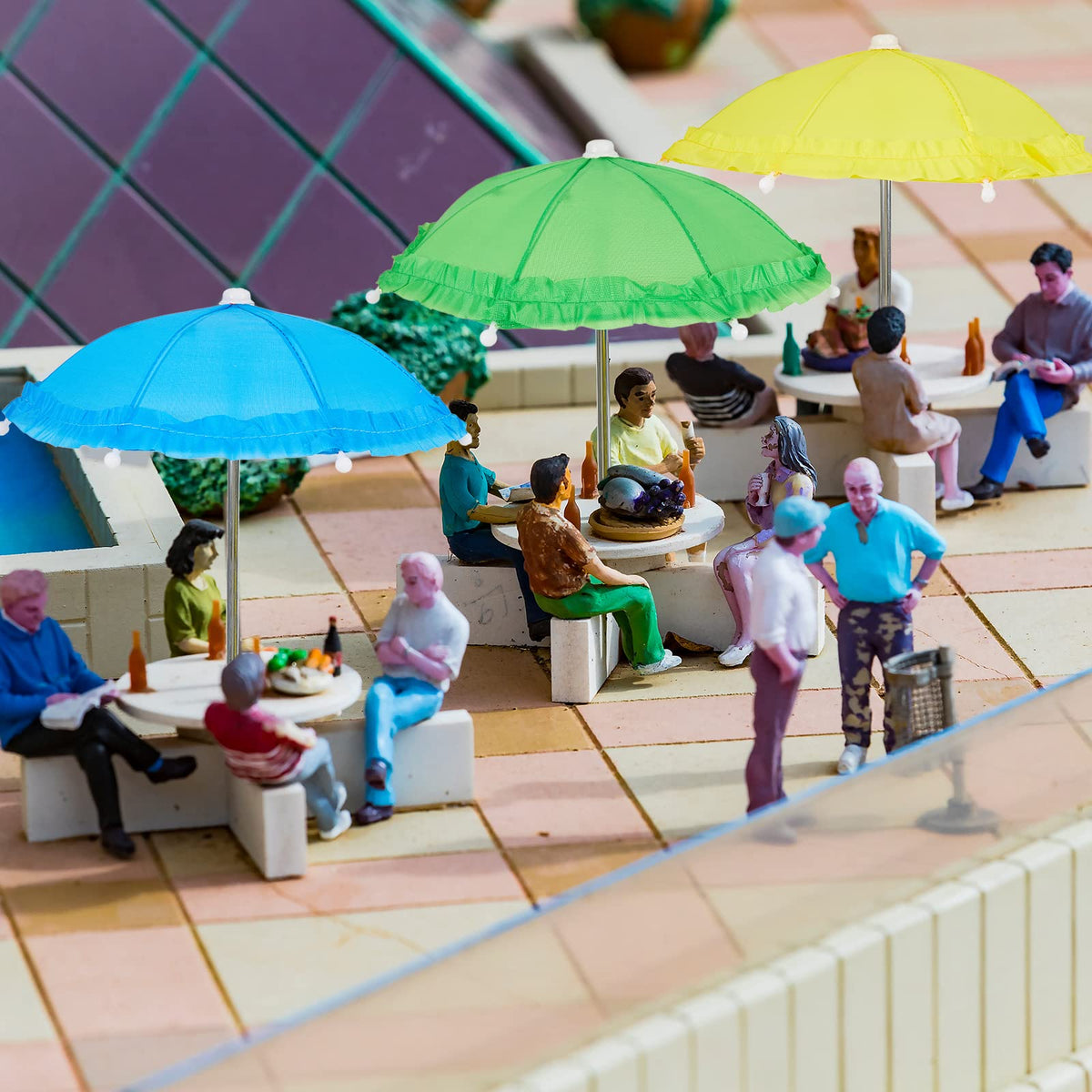 Eccliy indoor-outdoor display with small parasols adding color to shelves.