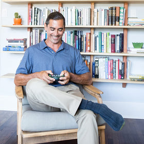 BrainBolt handheld design shown in use, ideal for solo play on the go.
