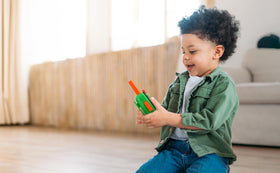 eKids TMNT walkie back view shows durable casing and easy battery access.
