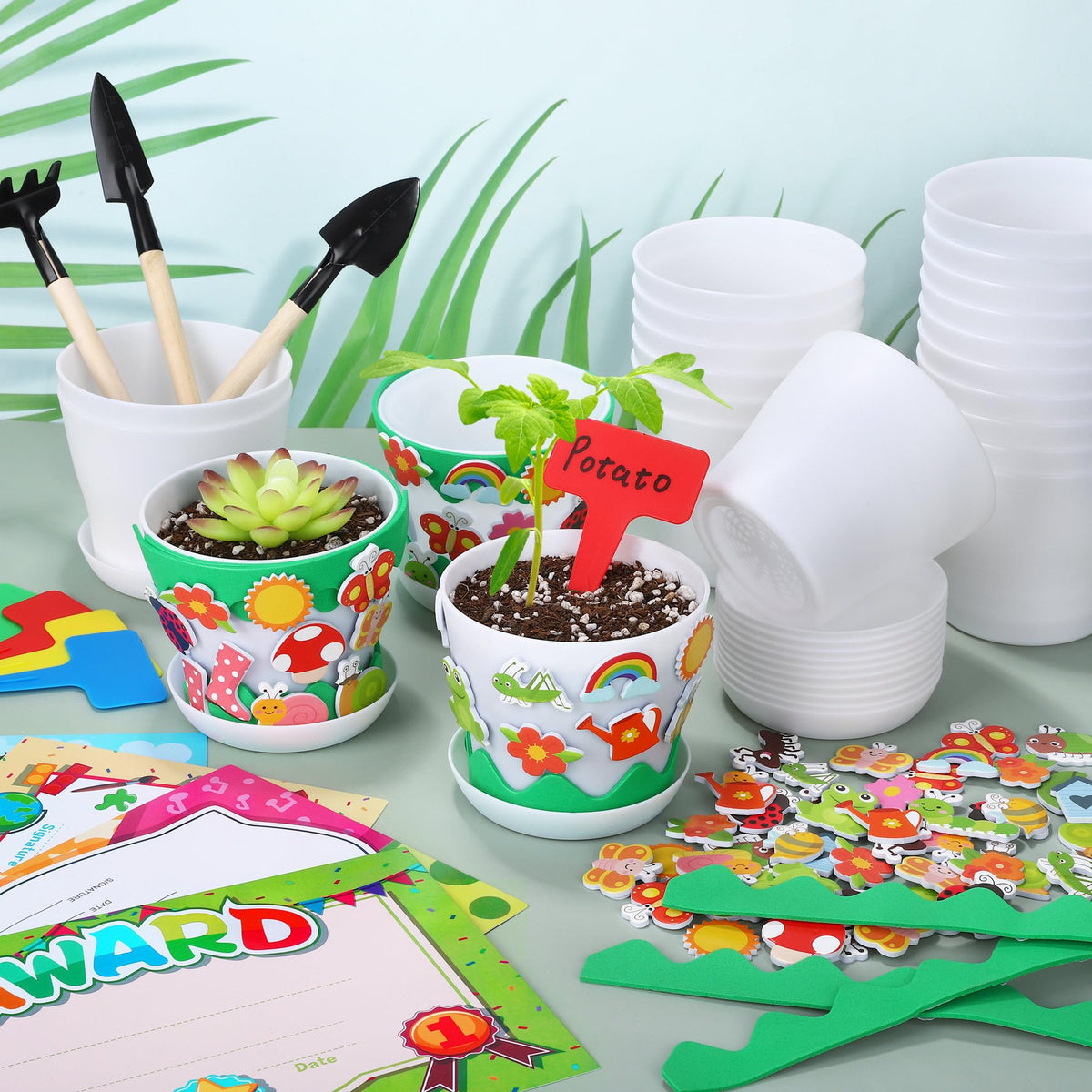 Elcoho awards certificates celebrate kids' planting achievements and creativity.