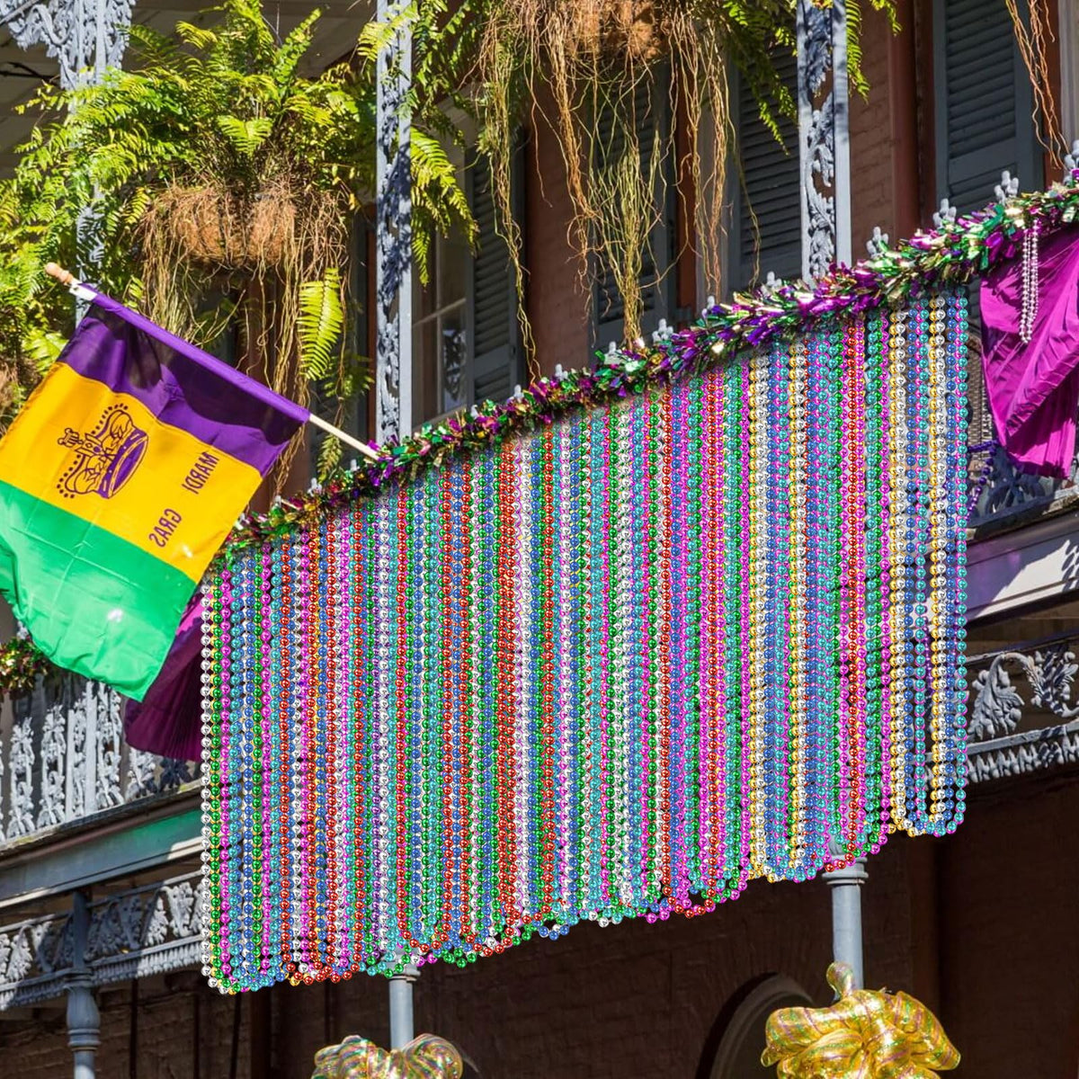 Elefama Mardi Gras beads parade throws for festive atmosphere.
