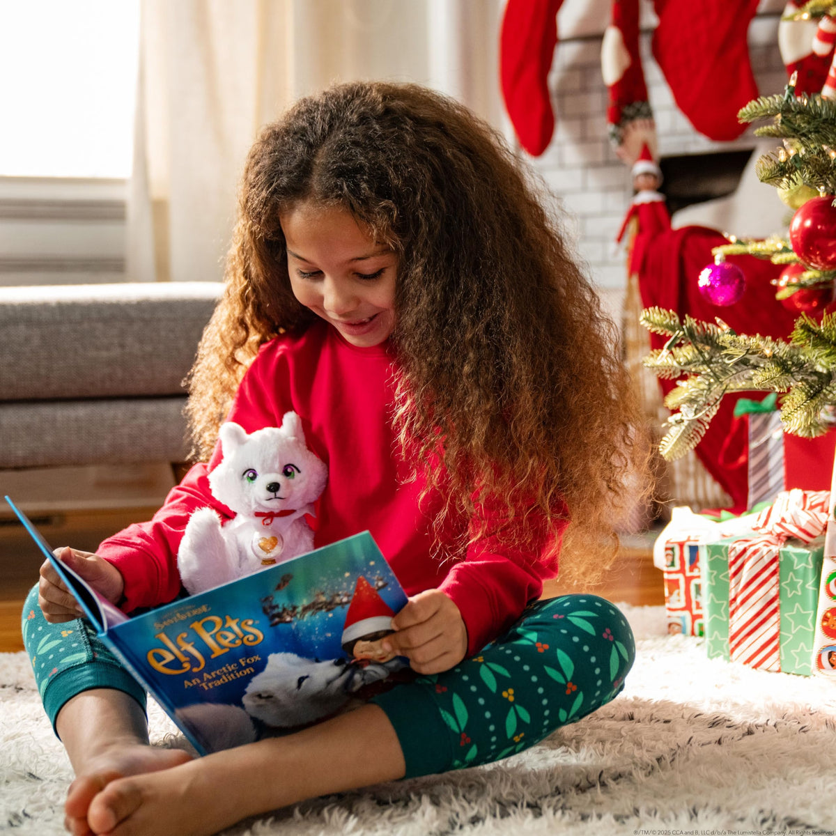 The Elf Pets Arctic Fox snow globe charm adds festive wonder.