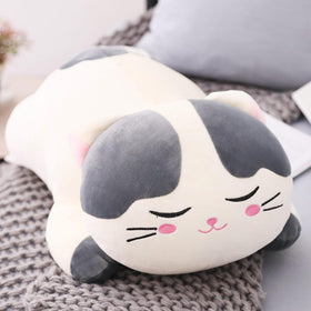 elfishgo cat plush cushion on a bed shows its soft, fluffy texture.