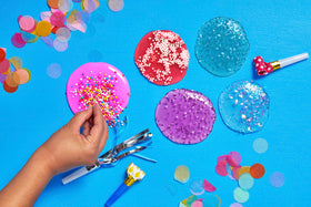 Elmer's Gue packaging and jars arrangement emphasizes kid-friendly setup.