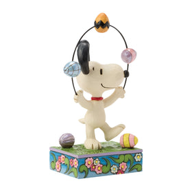 Enesco Snoopy on a floral grass base display for shelves.