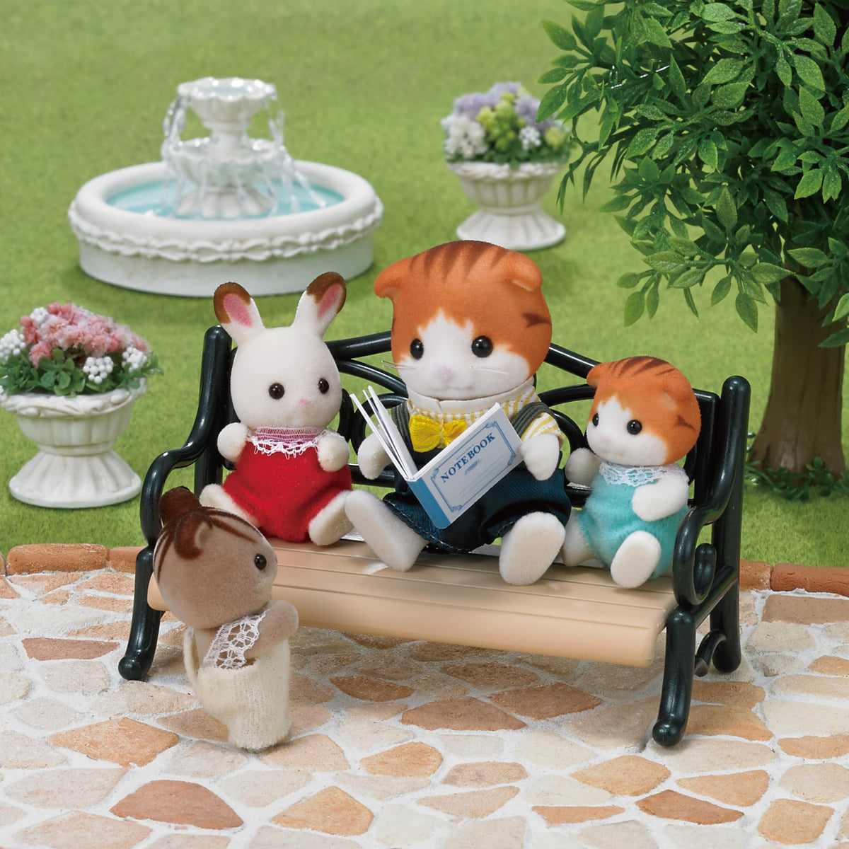 Epoch Sylvanian Maple Cat Boy reading a book to spark imagination