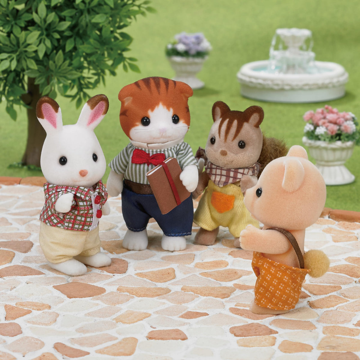 Epoch Sylvanian Maple Cat Girl among flowers for nature play