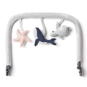 Ergobaby Evolve Toy Bar turtle bell stimulates auditory exploration for infants.