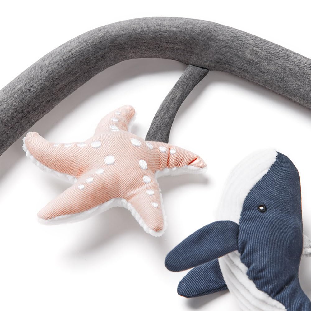 Ergobaby Evolve Ocean Wonders whale rattle promotes reaching and exploration with gentle sounds
