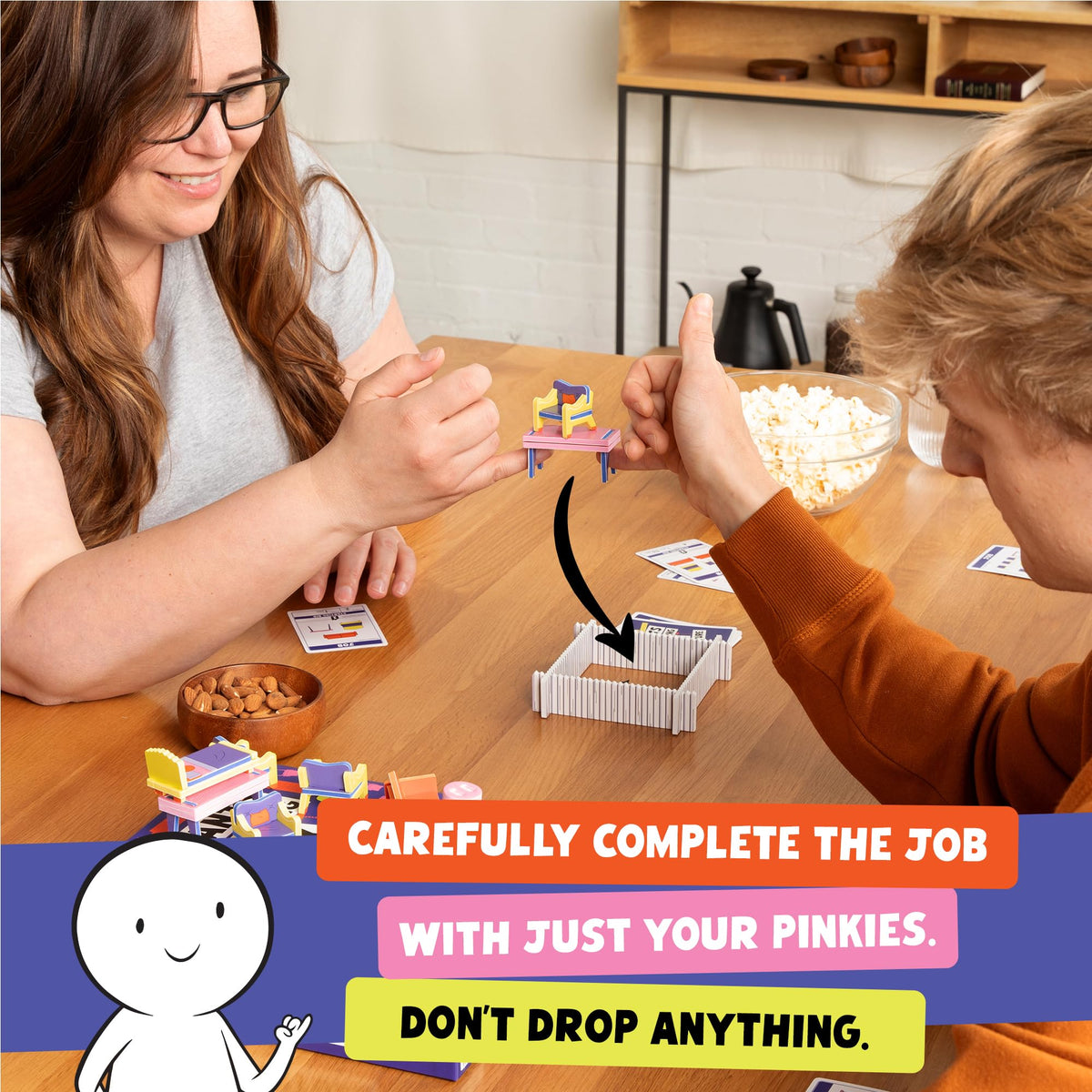 Exploding Kittens Giants Moving Tiny Furniture teamwork scenes highlight clear communication during fast moves.
