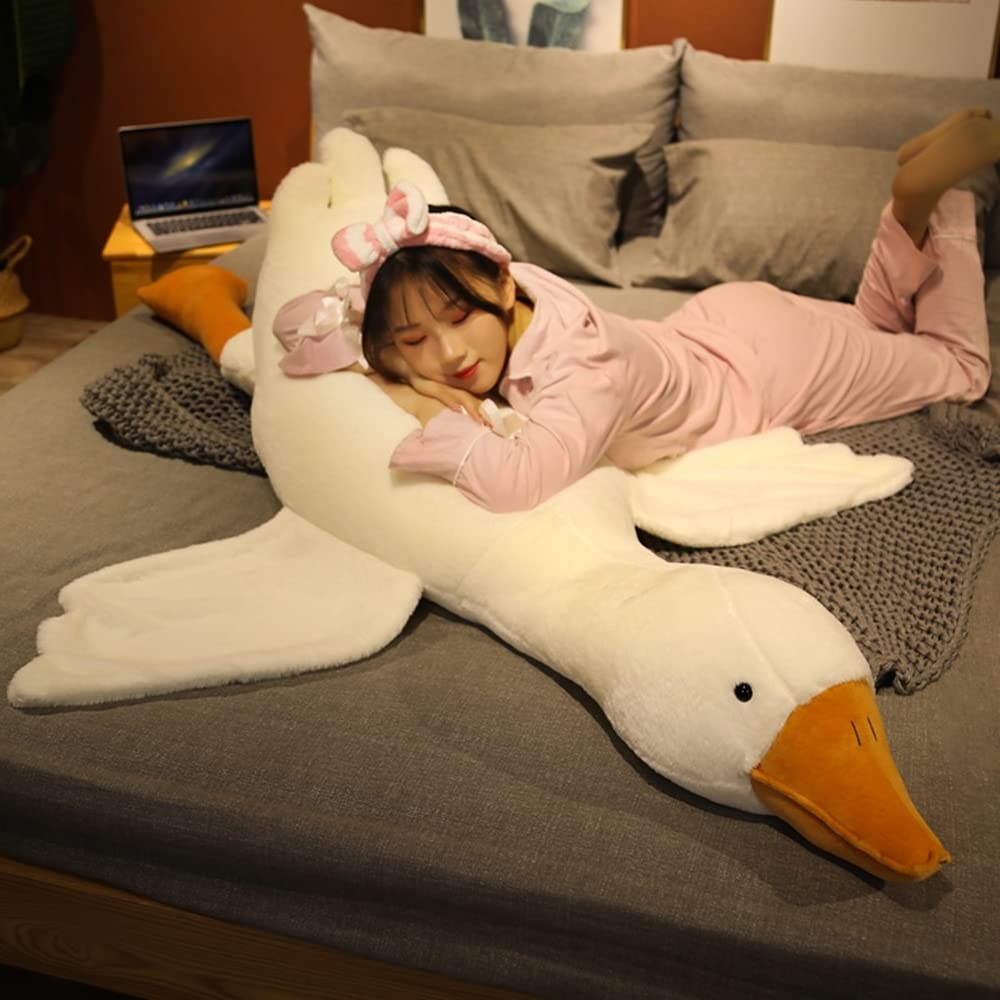 FANGYU decorative goose pillow stands tall on a sofa.