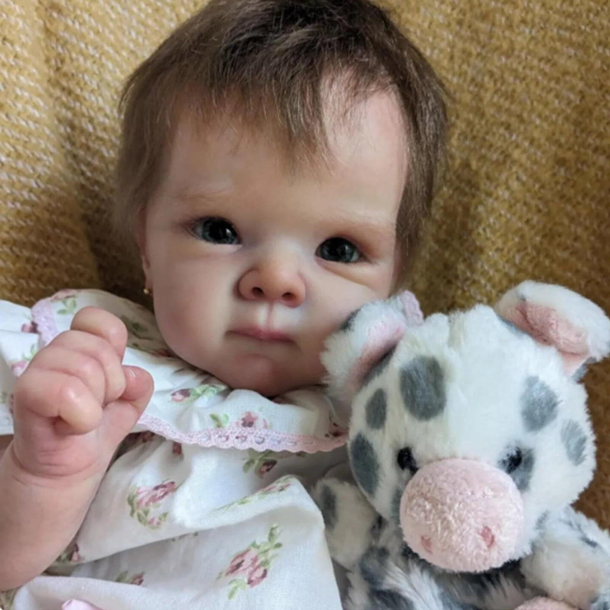 FASMAS Reborn doll skin-texture detail with rosy cheeks for authentic feel.